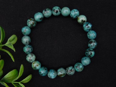 Stretch Bracelet With Variegated Green Beaded Design