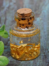 Small Glass Bottle With Gold Flakes and Cork Stopper