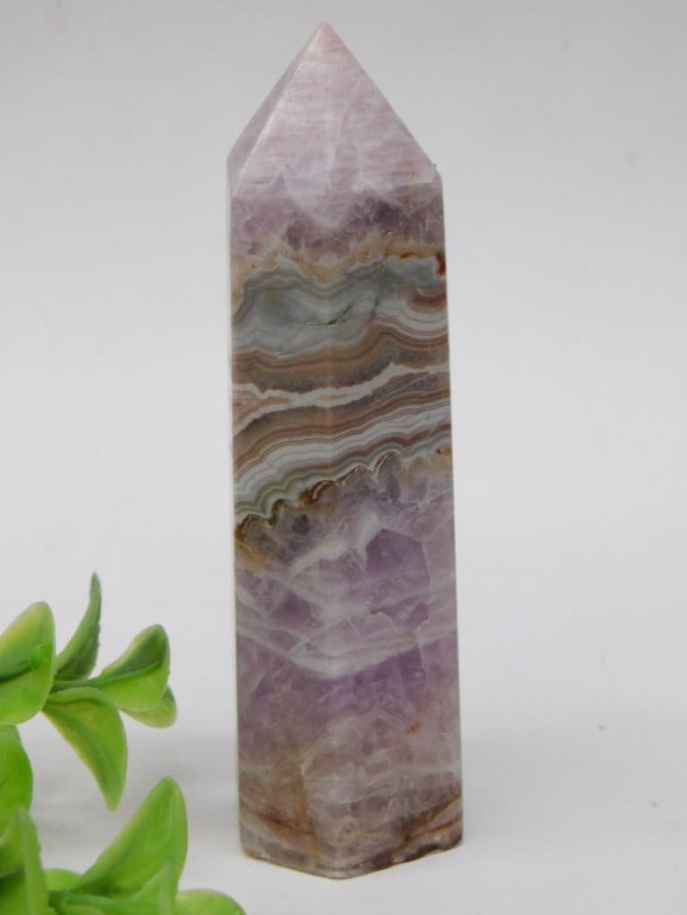 Amethyst Lace Agate Tower Rock Stone Lapidary Specimen: A polished Amethyst Lace Agate crystal point showcasing multicolor banding, predominantly featuring shades of purple, white, and green. This crystal measures approximately 79 grams as indicated. Its p