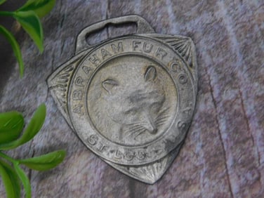 Abraham Fur Co. Metal Watch Fob, St. Louis USA