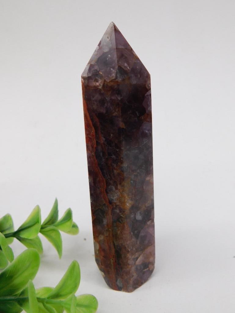 Pointed Crystal Wand, 92 Grams Rock Stone Lapidary Specimen: This polished crystal wand features a pointed design with vibrant natural coloration. It weighs 92 grams and showcases a combination of earthy and rich tones. Ideal for collectors or enthusiasts, its 