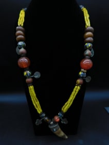 Necklace With Beads, Yellow Strands, and Horn Pendant