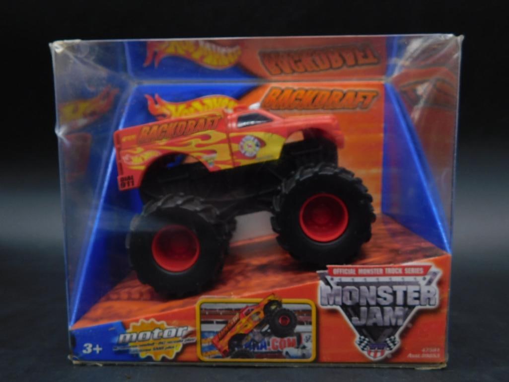 Hot Wheels Rev Tredz Backdraft Monster Jam Toy Truck: Hot Wheels Rev Tredz Backdraft toy vehicle from the Monster Jam series. Packaged in original box featuring vibrant graphics. Recommended for ages 3 and up. Includes licensed Backdraft design and Monst