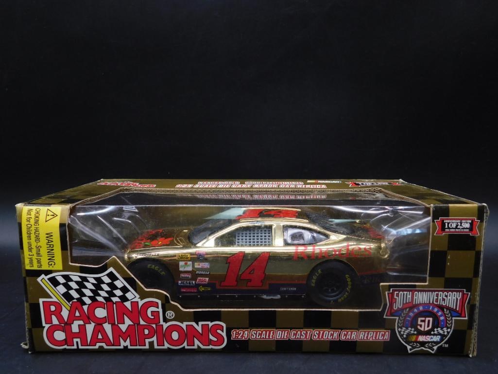 Racing Champions Gold 1:24 Die-Cast Car #14: Racing Champions 1:24 scale die-cast stock car replica featuring a gold finish. Marked with the number 14 and 50th Anniversary NASCAR branding. Comes in its original box with clear display window. The