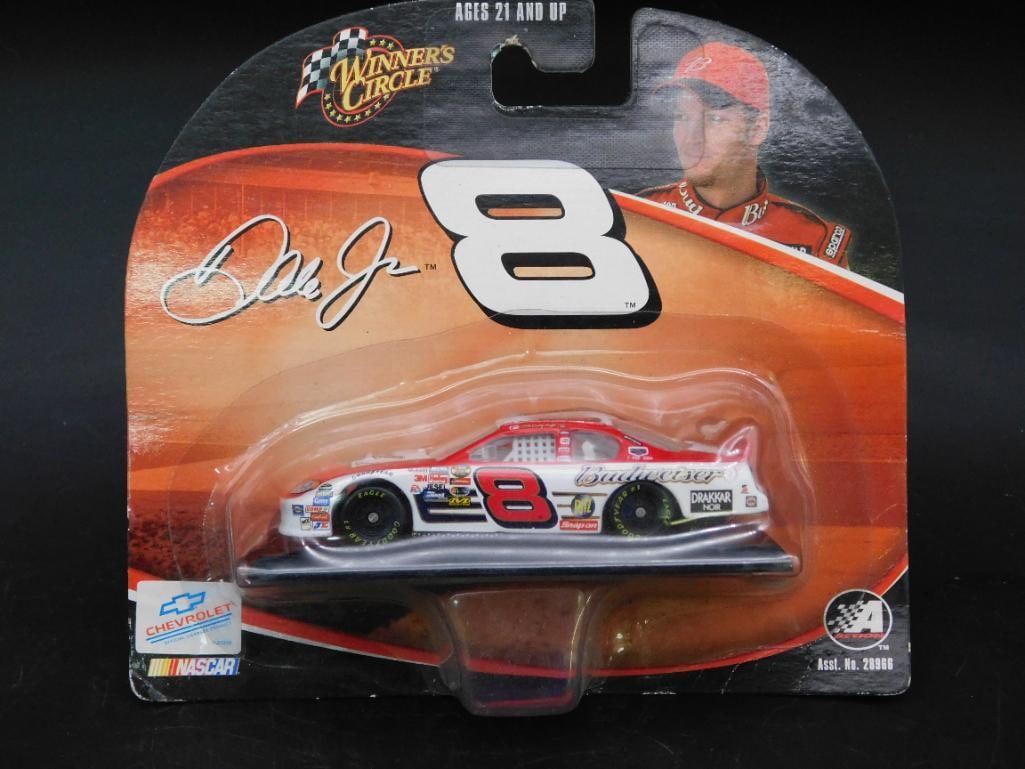 Winner?s Circle Dale Jr. #8 Chevrolet Die-Cast Car: Winner's Circle 1:64 scale die-cast model of Dale Earnhardt Jr.'s #8 Chevrolet race car, iconic Budweiser livery. Packaged in original unopened blister card featuring driver imagery and branding. Ages