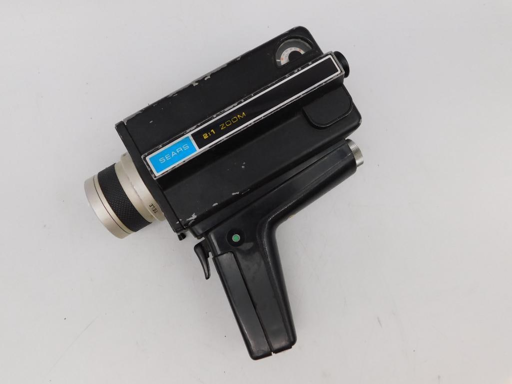 Sears C122 Super 8 Easi-Load Movie Camera With Box: This is a Sears C122 Super 8 Easi-Load movie camera featuring a TLS coated zoom lens, f/1.8. It includes a pistol grip design and original box. The unit is marked 'Made in Japan' and shows a serial nu