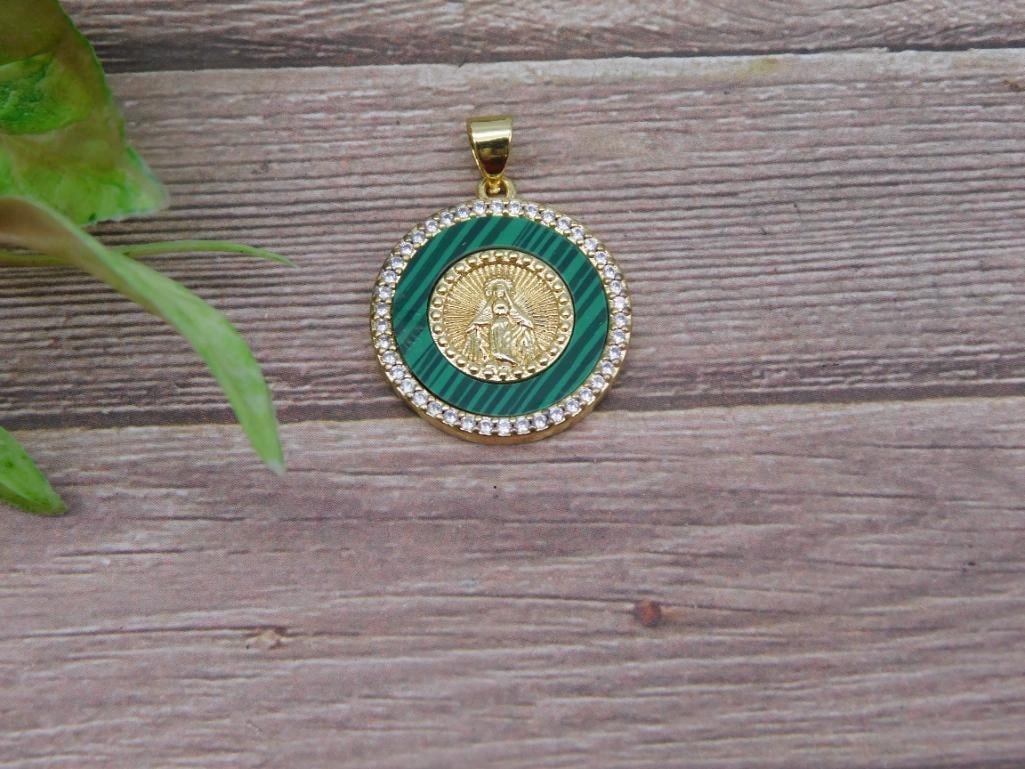 Gold and Green Coin-Style Pendant with Crystal Accents: This pendant features a gold coin-style centerpiece surrounded by a green enamel design, encircled by clear crystal accents. Includes a gold-toned bail for easy attachment to a chain. Compact design, 