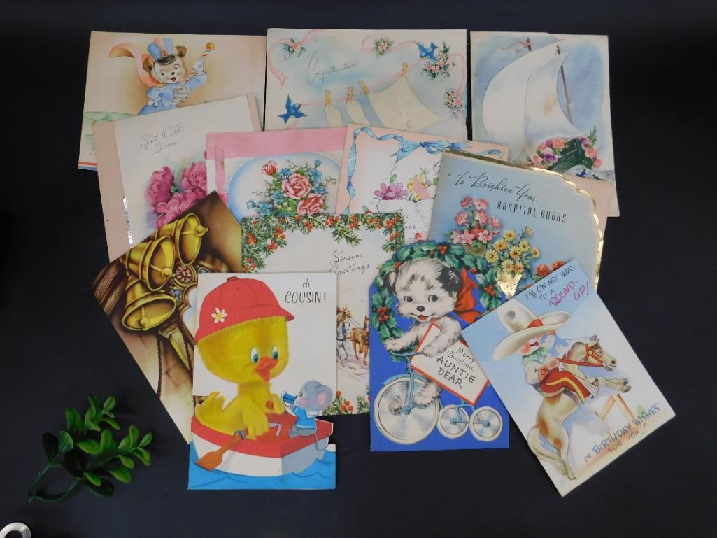 Collection of Assorted Greeting Cards Featuring Animal-Themed Designs: This lot includes a variety of greeting cards with predominantly animal-themed artwork. The collection features ducks, puppies, and horses, among others, crafted with vibrant colors and designs. Cards