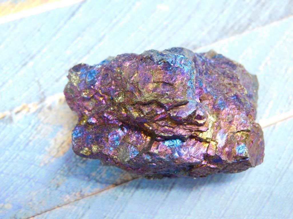 Peacock Ore Rock Stone Lapidary Specimen: - Natural chalcopyrite mineral specimen showcasing iridescent, rainbow-like colors. | - Approximate weight: 140 grams as noted in the image. | - Dimensions shown with a ruler for scale; ideal for coll