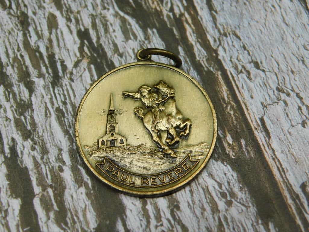 Paul Revere Bicentennial Commemorative Medal Pendant: - Circular medal featuring a depiction of Paul Revere on horseback and a church on one side, engraved with 'Paul Revere.' | - Opposite side features 'Cradle of Liberty 1776-1976' and 'United States of