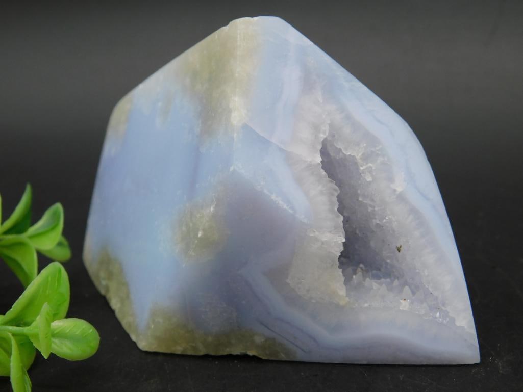 Blue Agate Geode Freeform Stone Display Piece: Blue agate geode freeform display stone featuring a polished exterior and natural geode cavity. The piece displays bands of blue and white with rough edges framing the crystalline geode center. Weight