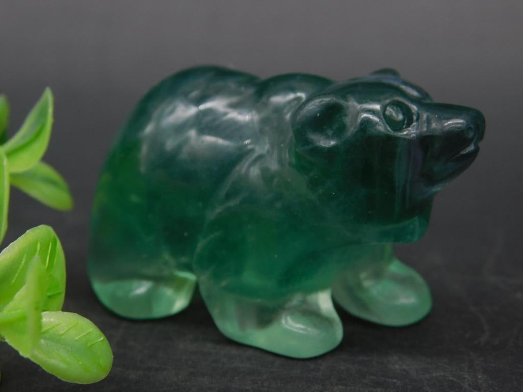 Green Carved Stone Bear Figurine, 59 Grams: This lot features a small green carved stone bear figurine weighing 59 grams. The bear is crafted with smooth detailing and rich green coloration, as shown in the images. The item may serve as a decor
