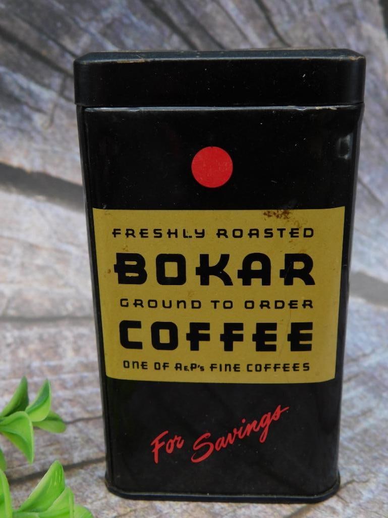 Bokar Coffee Tin Savings Bank: Bokar Coffee tin repurposed as a savings bank with a vintage design. Features the 'Bokar Coffee' label on the front, with 'For Savings' in red script below. Includes a coin slot on the top decorated w