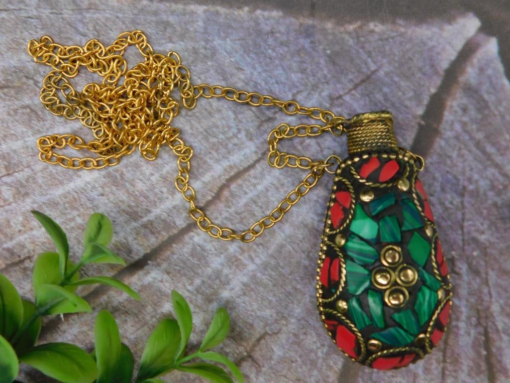 Gold-Tone Chain Necklace with Snuff Bottle: This necklace features a gold-tone chain and a decorative pendant. The pendant is vibrant with mosaic-style green and red detailing and intricate accent designs. The shape of the pendant is teardrop-l