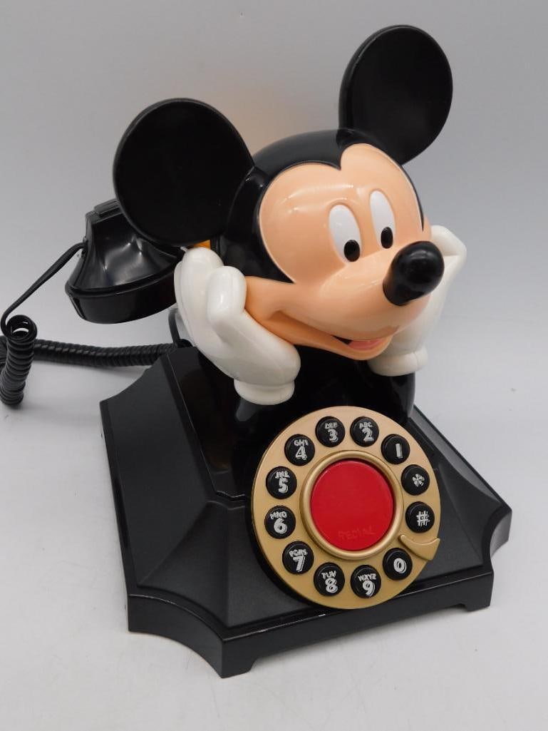 Disney Mickey Mouse Desk Telephone by Telemania: - Vintage Mickey Mouse desk telephone manufactured by Telemania. | - Features a rotary-style dial design with push-button dialing. | - Includes a black handset resting on Mickey Mouse?s hands and head