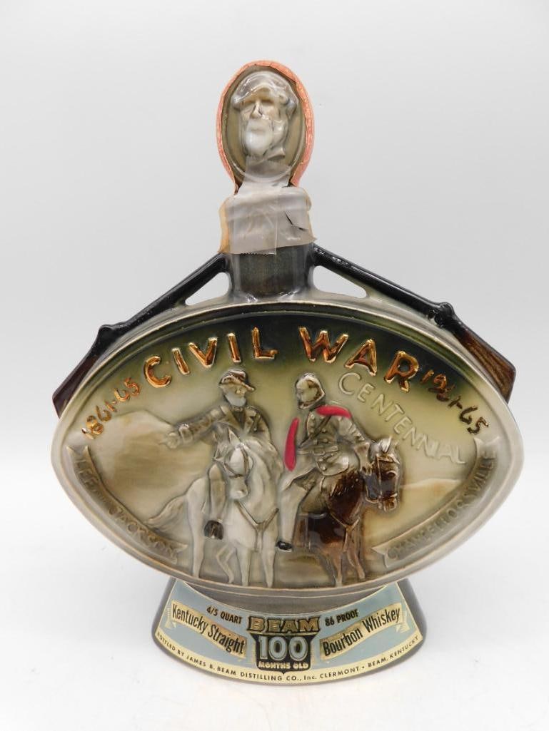 1865-1965 Civil War Centennial Bourbon Decanter by Ezra Brooks: - Commemorative Civil War centennial decanter, dated 1865-1965. | - Produced by Ezra Brooks Distilling Co., features Kentucky Straight Bourbon Whiskey. | - Crafted in ceramic with embossed horsemen sc