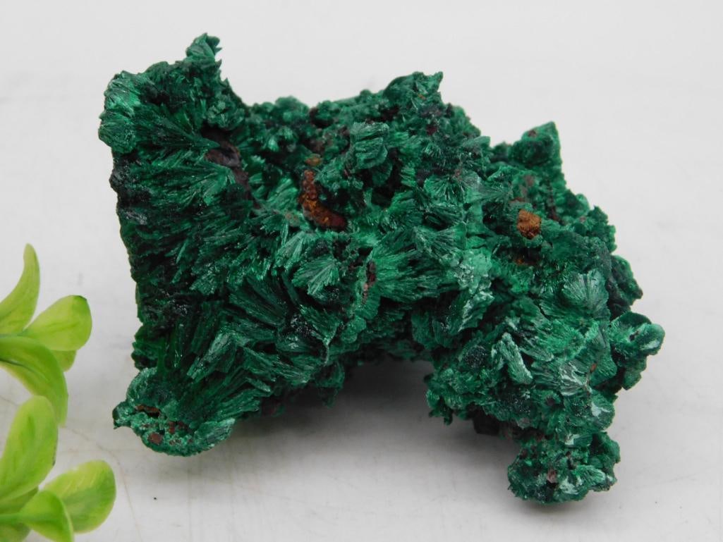 Malachite Mineral Specimen with Textured Surface Rock Stone Lapidary Specimen: - Natural malachite mineral specimen with a rich green coloration. | - Features a textured, fibrous surface highlighting its unique crystalline structure. | - Approximate weight labeled as 60 grams, a