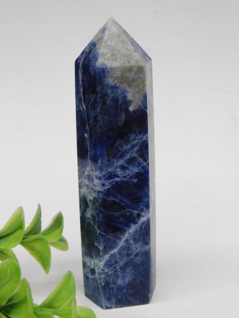 Polished Blue Sodalite Tower Rock Stone Lapidary Specimen: - Polished Sodalite crystal in a tapering tower shape with a pointed tip. | - Features a deep blue base with white veining and natural inclusions. | - Displayed alongside a ruler for scale; labeled we