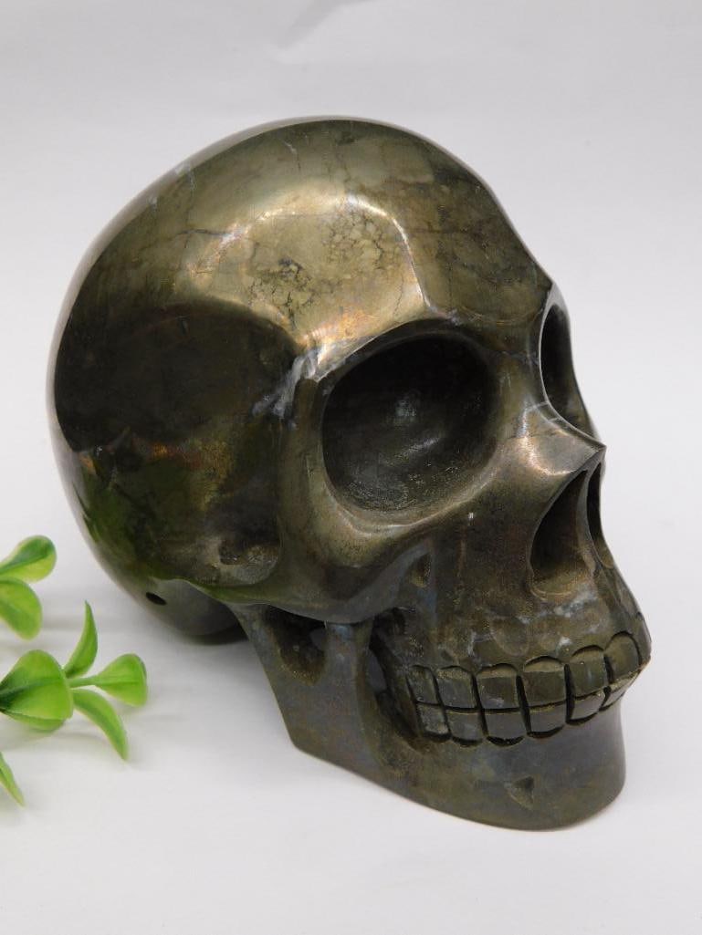 Huge Pyrite Stone Skull Sculpture 4 Pounds Rock Stone Lapidary Specimen: - Polished skull-shaped sculpture crafted from a metallic-looking stone | - Compact in size, as shown next to a standard soda can for scale | - Weight approximately 4 lbs 13 oz, as indicated on the me