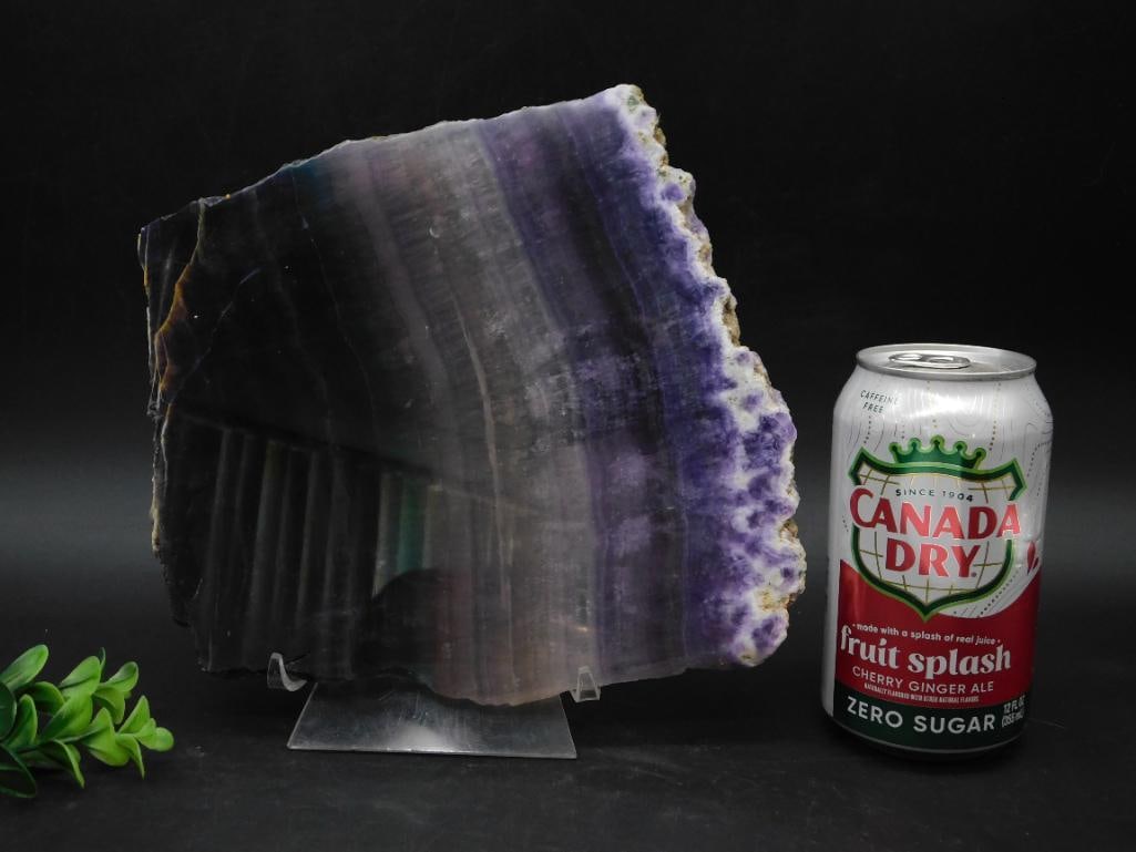 2 Pound Rainbow Fluorite Slab Rock Stone Lapidary Specimen: Fluroite featuring shades of purple and white. | - Comes with a clear stand for easy display. | - One edge highlights natural, raw formations, contrasting with polished surfaces. | - Provides decorati