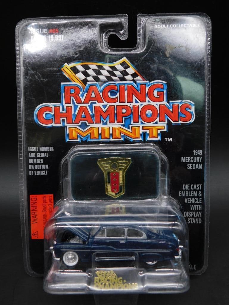 Racing Champions Mint 1969 Mercury Diecast Car: Racing Champions Mint diecast car featuring a 1969 Mercury in detailed packaging. Includes gold emblem and window display. Scale and additional specifics are not mentioned. The item is in its original
