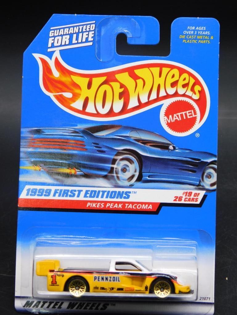 Hot Wheels 1999 First Editions Pikes Peak Tacoma: This is a Hot Wheels 1999 First Editions model, featuring the Pikes Peak Tacoma. It is the 19th out of 26 cars in the collection for that year. The packaging, marked with collector number #924, remain