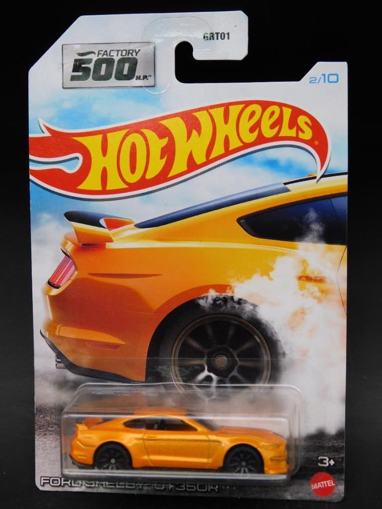 Hot Wheels Ford Shelby GT350R Die-Cast Car: Hot Wheels Ford Shelby GT350R die-cast car from the Factory 500 series, sealed in original packaging. Features an orange Ford Shelby GT350R car with detailed design. Package is numbered "2/10" in the 