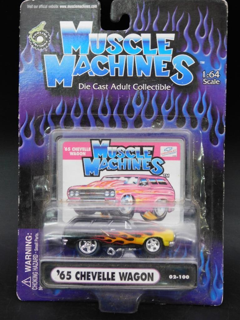 Muscle Machines 1:64 65 Chevelle Wagon Die-Cast: Muscle Machines 1:64 scale die-cast collectible featuring the '65 Chevelle Wagon. Item includes original packaging with flame graphics on the vehicle and detailed card art. Front packaging states '62-