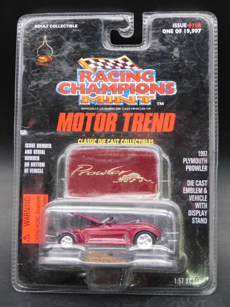 1997 Racing Champions Mint Plymouth Prowler Die-Cast Car: 1997 Racing Champions Mint Motor Trend collectible featuring the Plymouth Prowler. Includes a die-cast vehicle, display stand, and original packaging. Packaging appears sealed and measures approximate