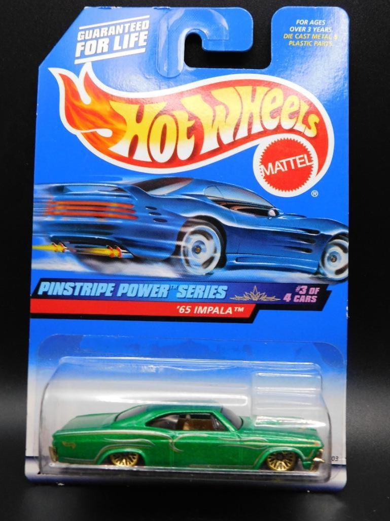 Hot Wheels Pinstripe Power 65 Impala in Original Packaging: Hot Wheels Pinstripe Power Series featuring a '65 Impala in green. Packaged in its original, unopened blister card with a signature design. The card shows minor wear consistent with age. Model #955 as