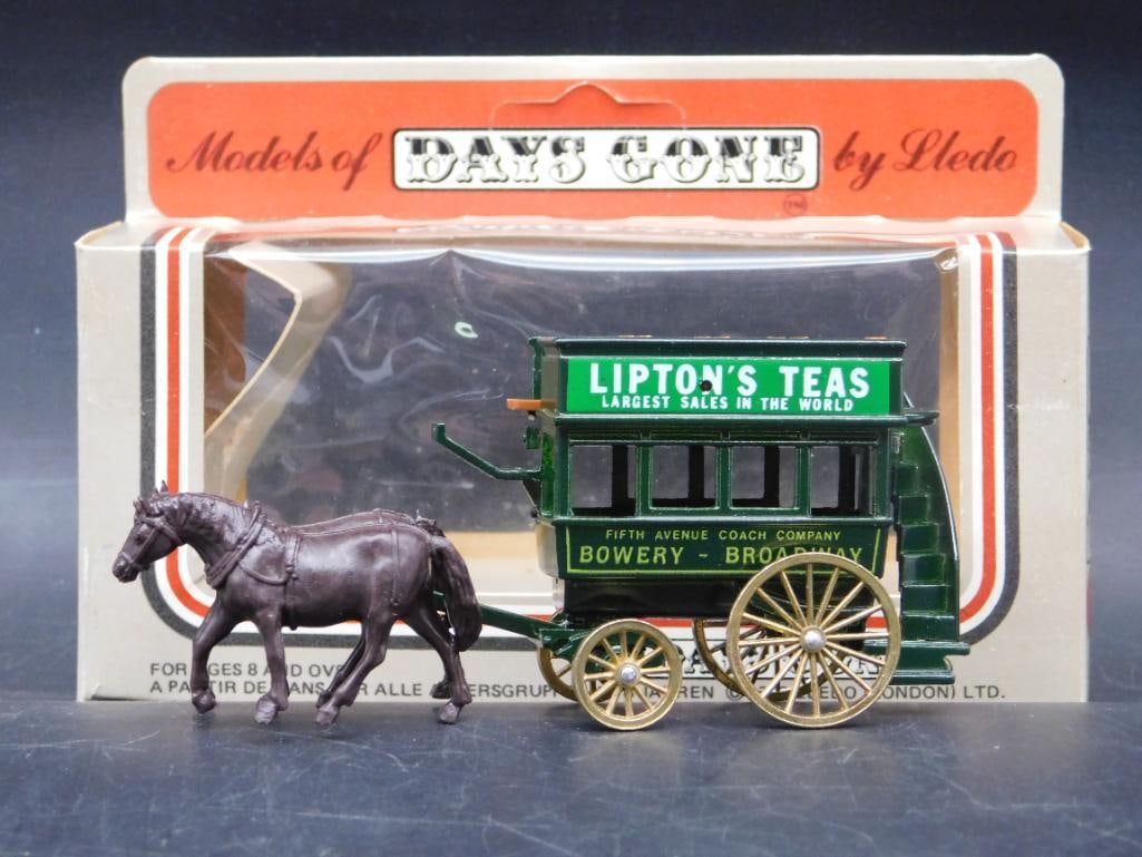 Days Gone by Lledo Horse-Drawn Liptons Tea Coach: This is a model from the Days Gone series by Lledo, featuring a horse-drawn coach with 'Lipton's Tea' advertisement. The set includes a brown horse and a green coach accented with gold wheels. It come