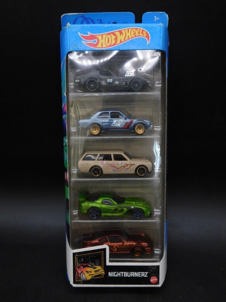 Hot Wheels Nightburnerz 5-Pack Die-Cast Cars: Hot Wheels Nightburnerz 5-pack featuring die-cast cars in original packaging. Includes five detailed car models with varied designs and colors. Packaging is intact with some signs of shelf wear. Suita