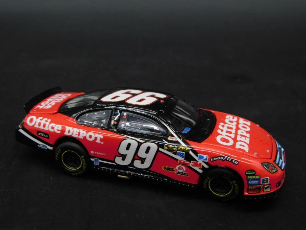 Owners Elite Office Depot No. 99 Diecast Model Car: This listing features an Owners Elite diecast model car featuring the No. 99 Office Depot design. It includes a detailed replica of the vehicle with authentic racing decals. The package includes the o