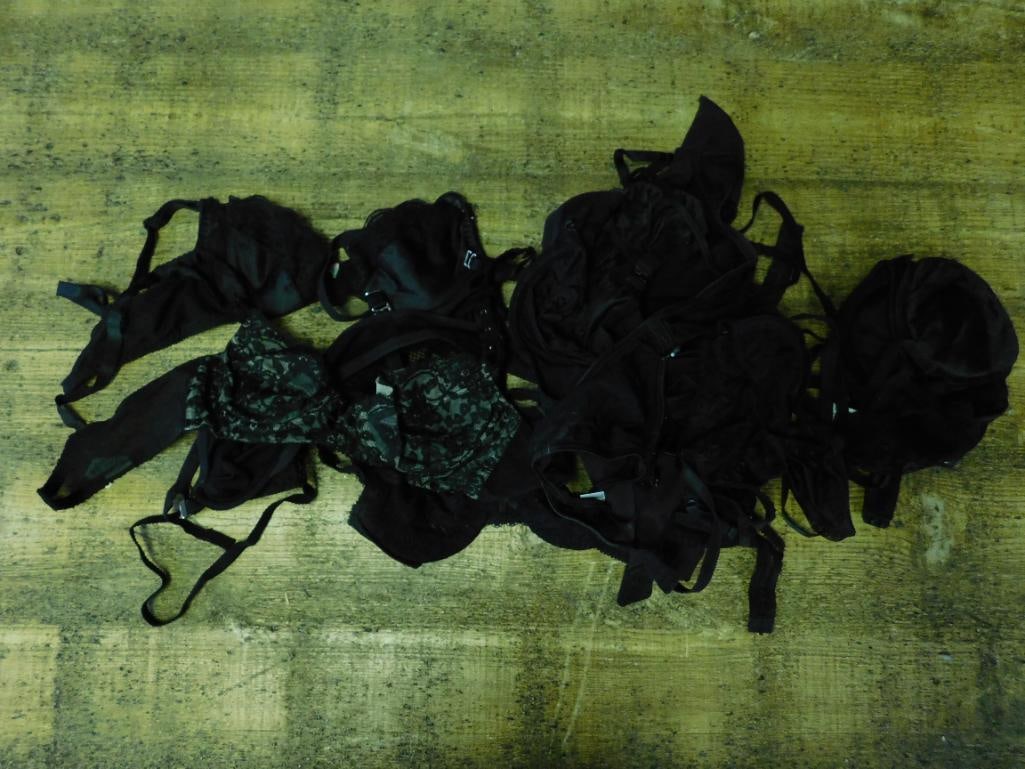 Collection of Black Bras ? Various Sizes and Brands: Lot includes a collection of black bras from various brands, including GAP and Bali. Several sizes are visible on the labels, such as 32B and 34B. Composition materials include nylon, polyester, and s