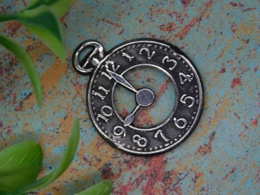 Silver-Toned Clock Pendant with Numeral Design
