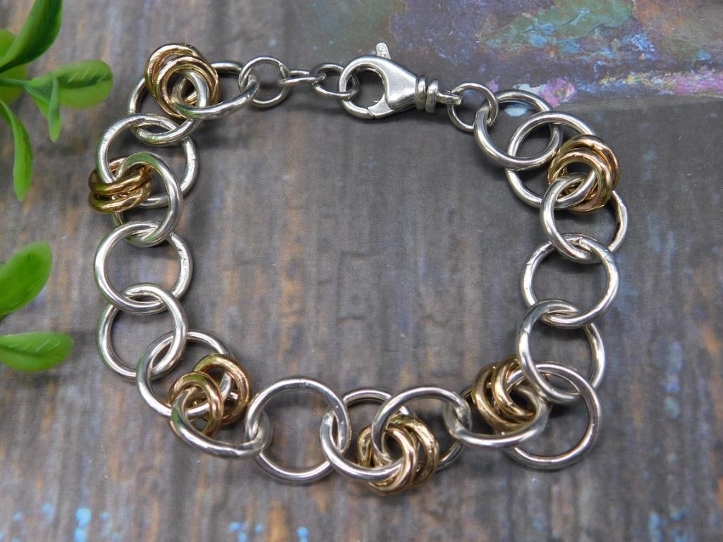 MIXED METAL LINK BRACELET: MIXED METAL LINK BRACELET ANY PURCHASE OF GOLD, SILVER, OR DIAMONDS OVER $300 WILL REQUIRE PAYMENT VIA WIRE TRANSFER OR CASH.