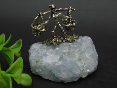 Metal Figure on Rock Crystal Display