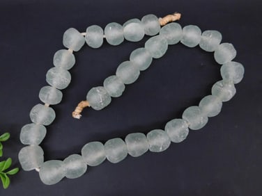 Strand of Sand-Cast Glass Beads on Cord