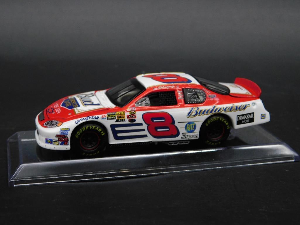 Dale Earnhardt Jr. #8 2004 Monte Carlo Diecast Car: This is a Dale Earnhardt Jr. #8 Budweiser 2004 Monte Carlo Elite diecast car by Action Collectibles. It is presented in the original display case with a detailed marking of the car's specifications. T