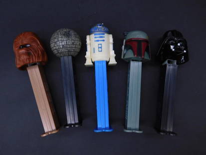 Set of Five Star Wars-Themed PEZ Dispensers: This lot includes five Star Wars-themed PEZ dispensers featuring iconic characters and designs: Chewbacca, Death Star, R2-D2, Boba Fett, and Darth Vader. Each dispenser features a detailed character d