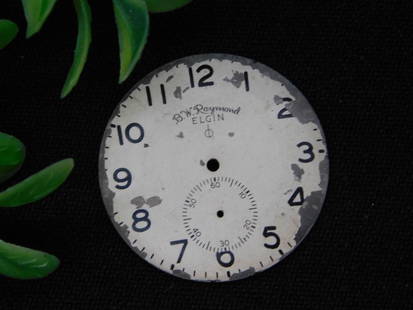 Vintage Elgin Pocket Watch Dial with Sub-Seconds WATCHMAKER WATCHMAKING TOOLS: - Vintage Elgin pocket watch dial with sub-seconds display. | - Marked "B.W. Raymond Elgin." | - Features black Arabic numerals and sub-dial graduation marks. | - Displays signs of wear and patina
