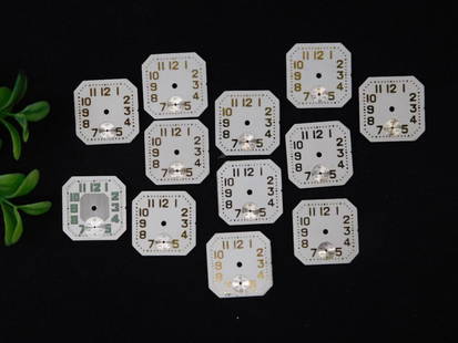 11 Vintage Octagonal Clock Faces with Subdials WATCHMAKER WATCHMAKING TOOLS: - Includes 11 vintage octagonal clock faces featuring various designs and styles, primarily white with numbering and subdials. | - Made of metal with detailed numbering and subdial features. | -