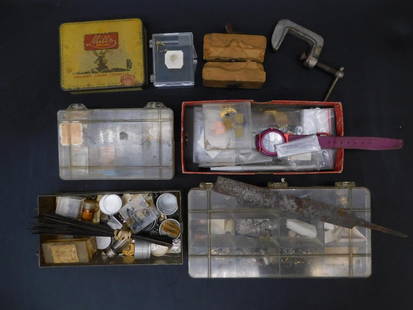 Watchmaking and Craft Tools WATCHMAKER WATCHMAKING TOOLS: - Includes various containers filled with watch components, tools, and small parts. | - Vintage Mill's cigarette tin repurposed for storage. | - Transparent plastic compartments with visible watch-rel