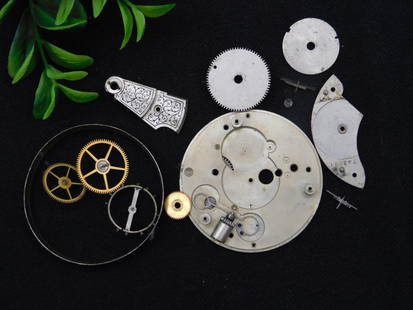 Vintage Watch Movement Parts for Repair or Craft WATCHMAKER WATCHMAKING TOOLS: - Lot includes multiple vintage watch movement parts. | - Features gears, plates, and balance wheels in various materials, such as metal and brass. | - Includes partially assembled and loose component