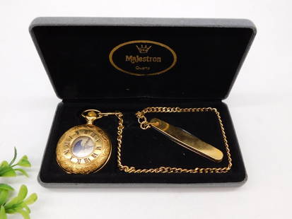 Majestron Pocket Watch With Chain and Folding Knife Set WATCHMAKER WATCHMAKING TOOL: - Majestron pocket watch with gold-tone finish and Roman numeral dial. | - Decorative moon phase design and intricate detailing on the watch face. | - Includes matching gold-tone chain and folding kni