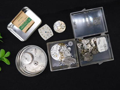 Watch Movement and Parts Lot WATCHMAKER WATCHMAKING TOOLS: Includes a collection of watch movements and parts stored in various containers. | Contains gears, dials, plates, and other components required for watch assembly or repair. | Packaging includes tin