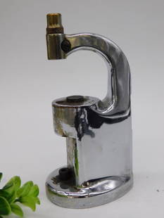 Vintage Staking Tool WATCHMAKER WATCHMAKING TOOLS: Vintage Staking Tool. Features a sturdy metal build with a curved spout design. | Includes a brass nozzle attachment at one end. | Shows signs of wear, including minor rust and surface blemishes. |