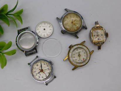 Vintage Watch Cases and Parts Assortment WATCHMAKER WATCHMAKING TOOLS: Includes a collection of six vintage watch cases and parts. | Features one Omega-branded watch case with visible diamond-like accents. | Includes multiple watch faces, complete with visible numerals
