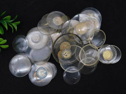 Collection of Vintage Glass Watch Crystals WATCHMAKER WATCHMAKING TOOLS: Features a mixed assortment of vintage glass watch crystals. | Includes both convex and flat designs with varying diameters. | Some crystals have visible markings or labels. | May include new old