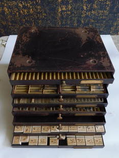 Vintage Watchmaker?s Parts Cabinet with Assorted Contents WATCHMAKING WATCHMAKER TOOLS: Multi-drawer wooden cabinet designed for organizing watchmaker's parts. | - Includes an assortment of labeled small boxes containing various watch components marked with series names and numbers. | -